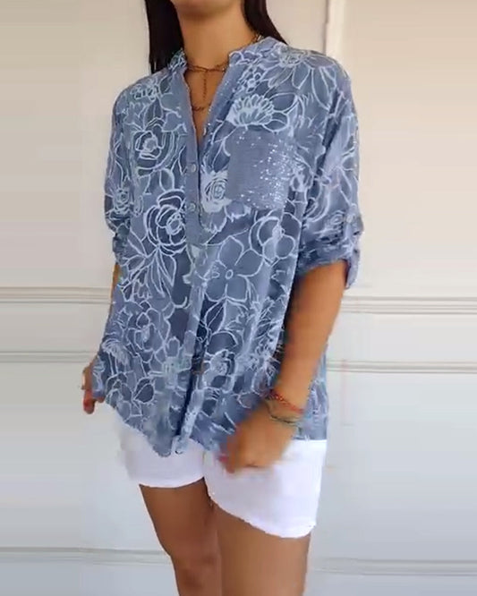 Kélya | Ruime blouse met bloemenprint en pailletten